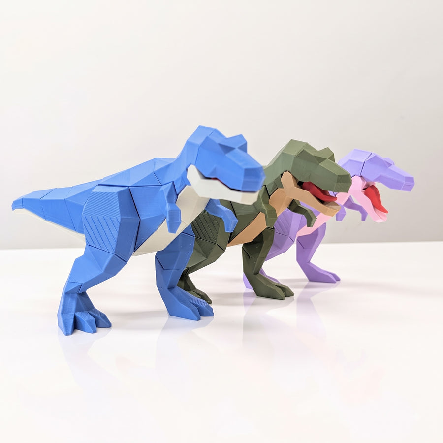 3D printed T-Rex Tyrannosaurus articulated toys by KalaaDhara in blue, green and lilac, side view