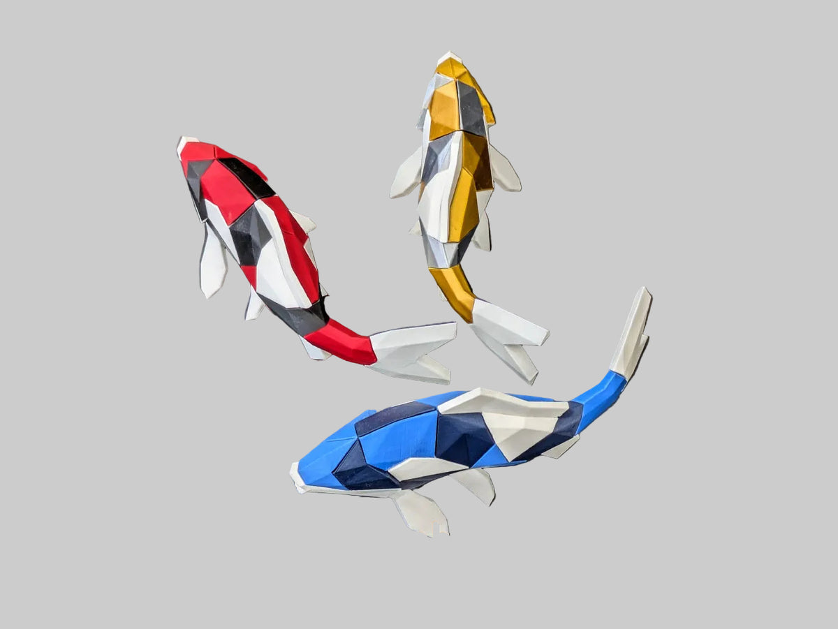Three low-poly koi fish sculptures on a dark gray background, with a 'Thanabun Lab' logo at the bottom.